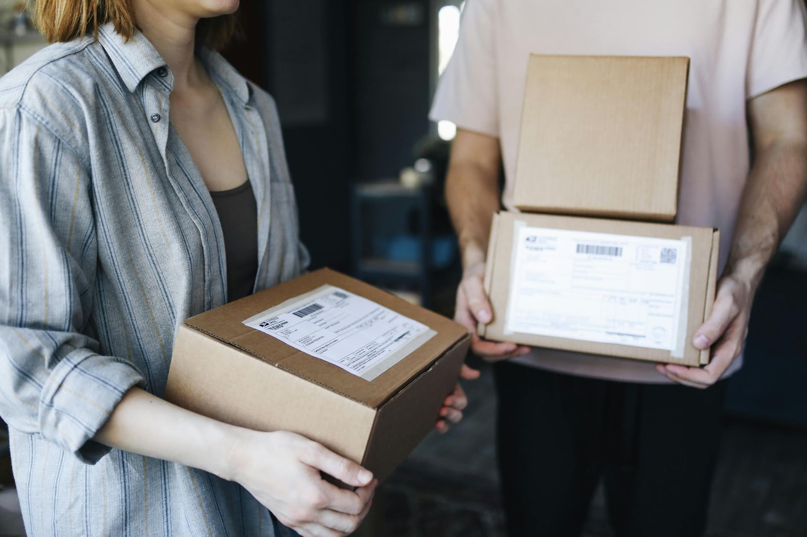 Two people carry delivery boxes – Slotted